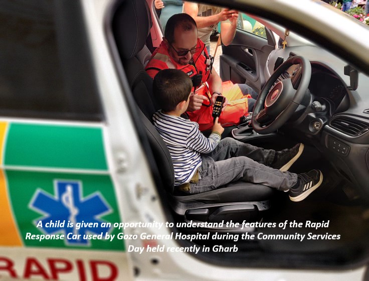 A child is given an opportunity to understand the features of the Rapid Response Car used by Gozo General Hospital during the Community Services Day held recently in Għarb